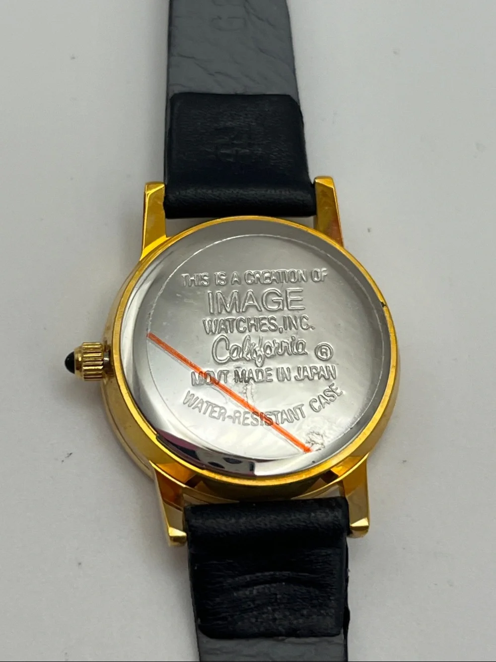 Gold-Tone Watch with Black Leather Strap